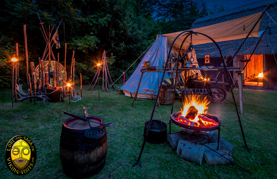 Viking Living History Camp at night by a Longhouse - Image copyrighted © Gary Waidson. All rights reserved.